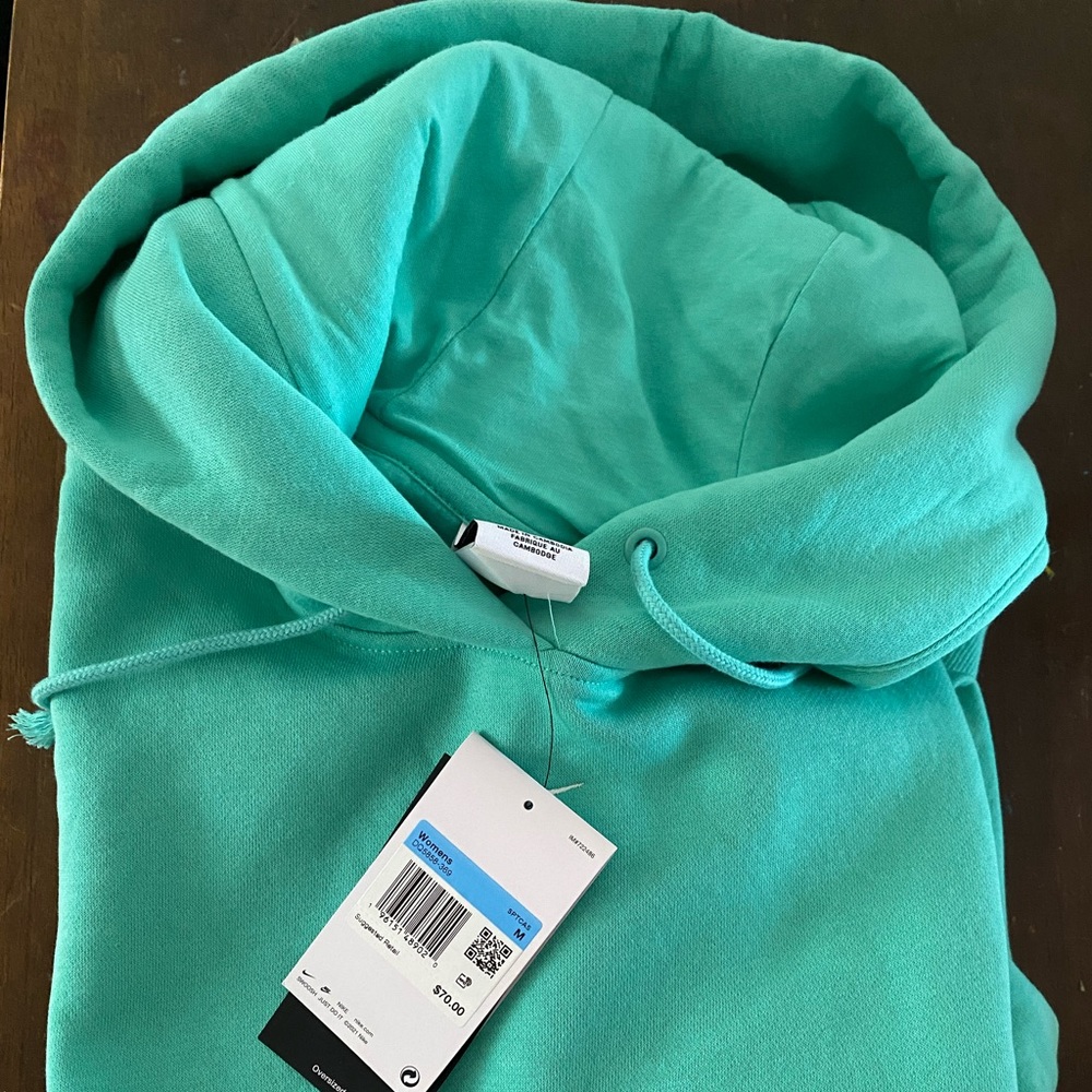 Light green Nike hoodie/sweatshirt women’s size Medium.